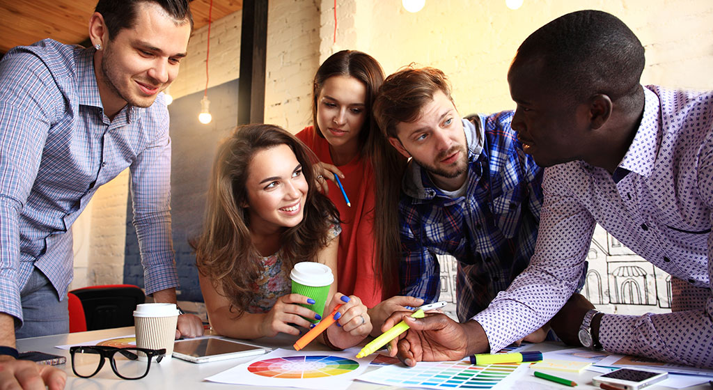 Students working together around a table.