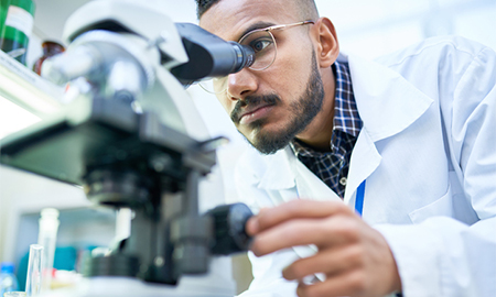 Man looking in microscope