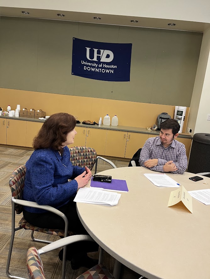 Provost having a discussion with faculty member