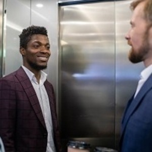 two people talking in an elevator