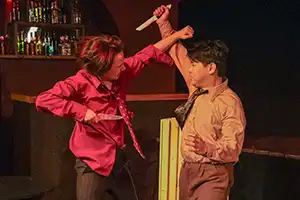two actors fight with knives