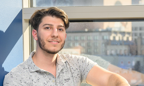 Transfer student sitting by a window
