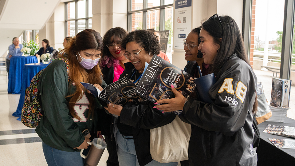 Students reviewing the new Skyline magazine