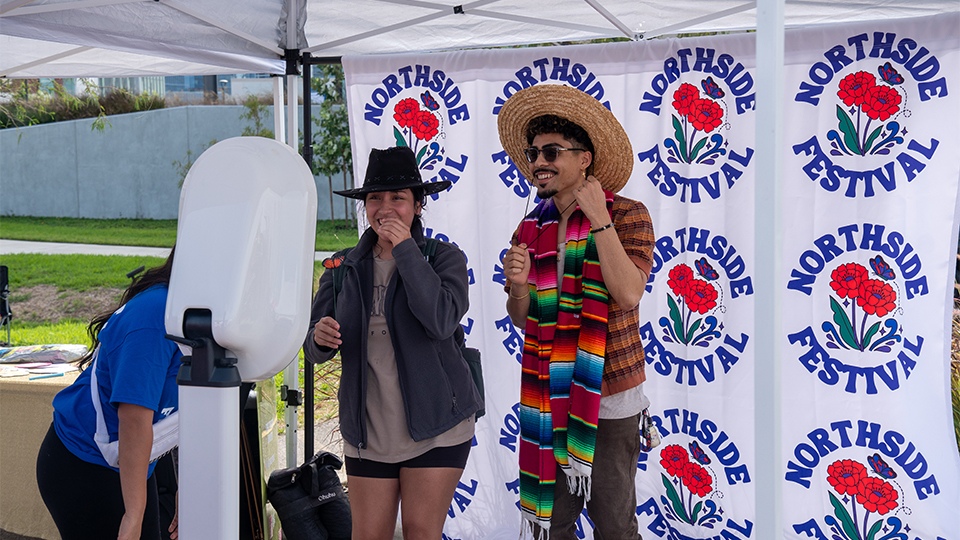 pair of people dressing up for a photo booth