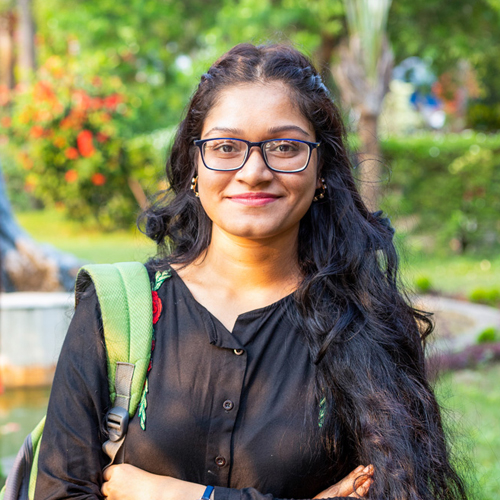 female student smiling at the camera