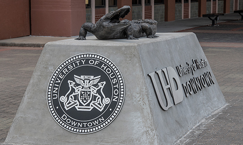 bronze gator statue outside One Main building