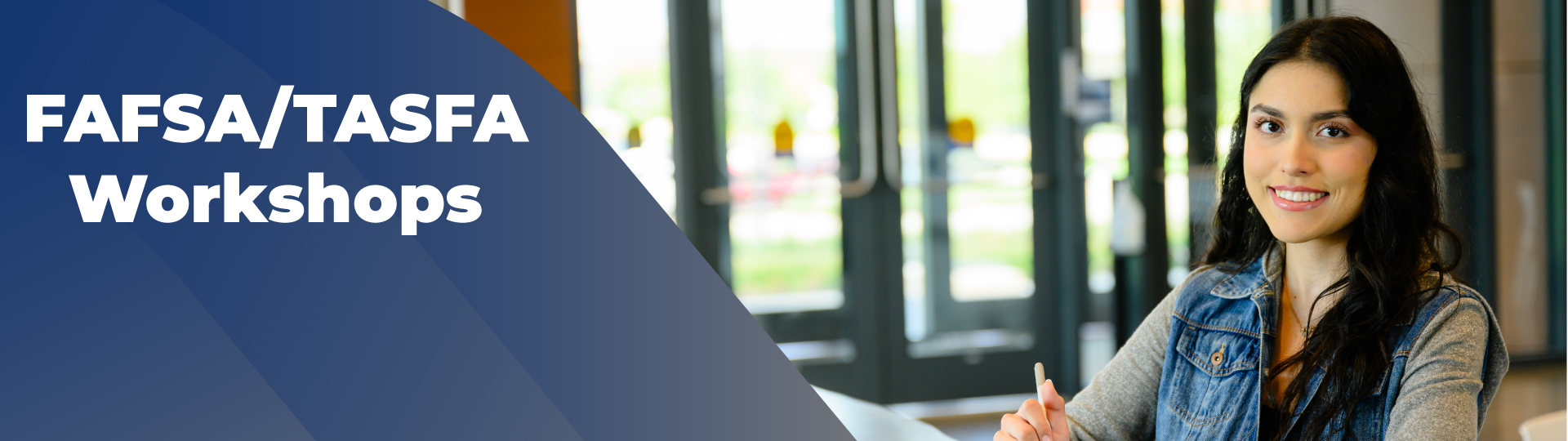 Student sitting at a table and writing