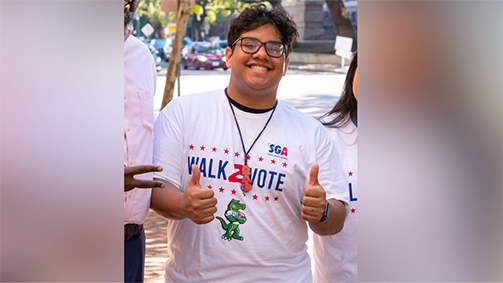 Maximiliano Perez poses in a Walk2Vote t-shirt