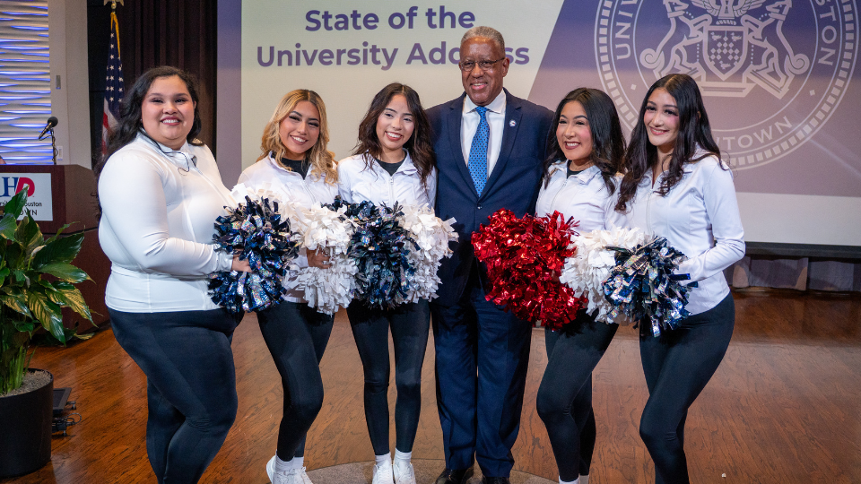 UHD Cheerleaders with UHD President at State of Address
