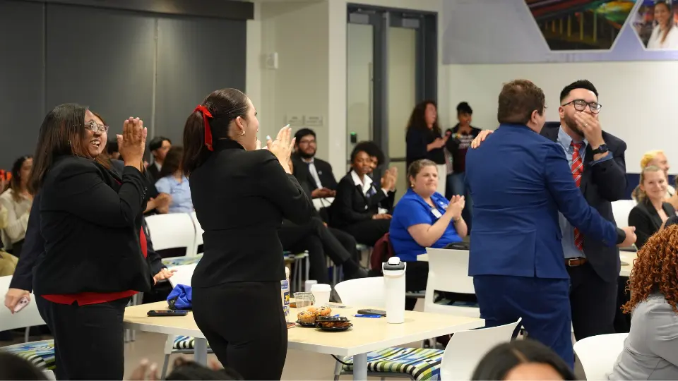 SHRM conference attendees standing and clapping