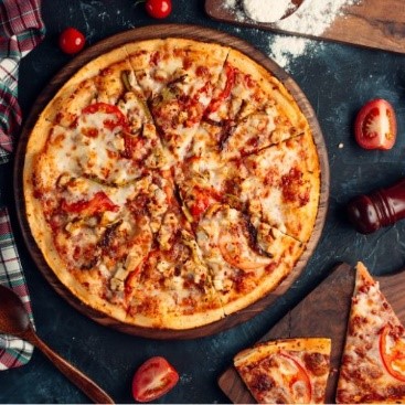 Overhead photo of a buffalo chicken pizza.