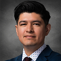 Adolfo Lara, first-generation Latino and global health scientist, smiles. Lara was the first UHD alum to earn a Ph.D. from the graduate program at the American Museum of Natural History.