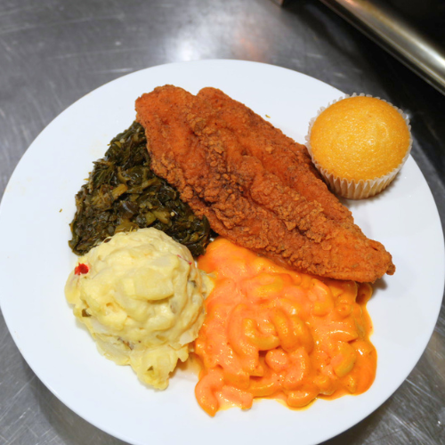 A plate of fried catfish, baked macaroni, collard greens at the university of houston-downtown food court