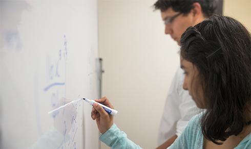 students at the marker board