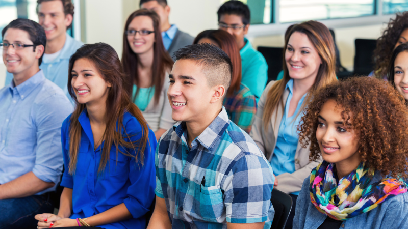 Woman standing during a group meeting