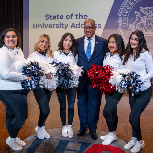 University of Houston Downtown President Loren J Blanchard stands aside the university's Gatorettes dance team at the 2025 State of the University Address