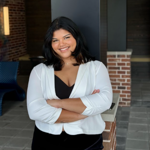 Eboni Watkins transfer student and human resources major smiles with her arms crossed