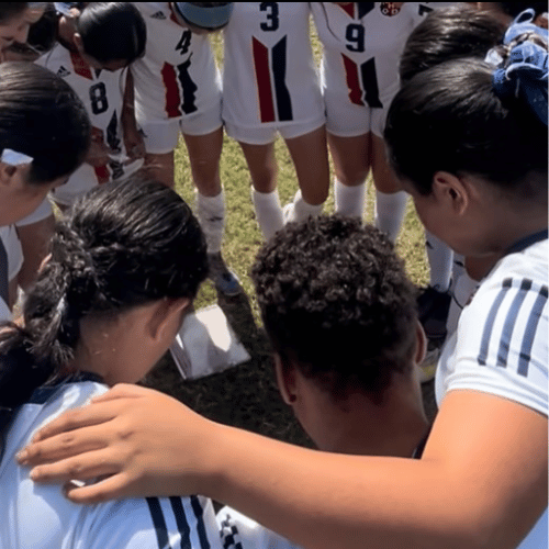The University of Houston Downtown's women's soccer team huddles during a match