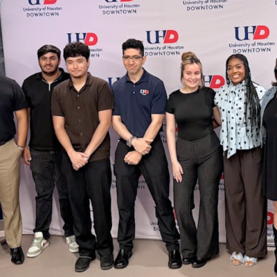 Fernell Jimenez-Pabon smiles with summer bridge students at the university of houston-downtown. Jimenez Pabon is a University of Houston-Downtown alumni and a Adjunct Professor for the Department of History, Humanities and Languages