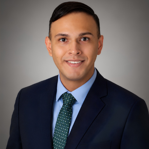 Ramiro Hernandez smiles. Hernandez is the University of Houston-Downtown Registrar.
